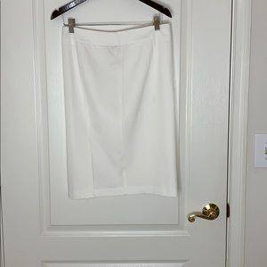 White knee length skirt.